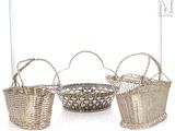 three baskets are lined up in a row on a white surface