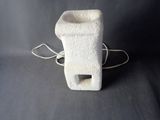 a small white object that is sitting on a table