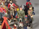 a lot of figurines that are sitting on a table
