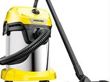 a yellow and black vacuum cleaner with a black hose