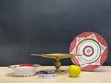 a table with a plate, bowl, and lemon on it