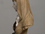 marble bust of a woman with a veil on her head