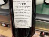 a bottle of wine that is being held by a person