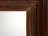 a close up of a mirror in a wooden frame with a white background