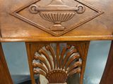 a wooden chair with a blue seat and a wooden back