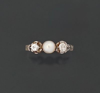 Bague jarretière en platine 850 millièmes ornée d'une perle …