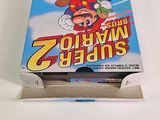 a box of nintendo wii games on a table