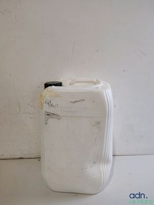 a white suitcase sitting next to a white wall