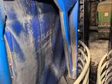 a picture of the inside of a blue truck with a lot of hoses