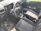 a picture of the interior of a car with a steering wheel