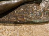 a bronze statue of a baseball player holding a bat