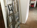 a ladder that is leaning against a wall in a room