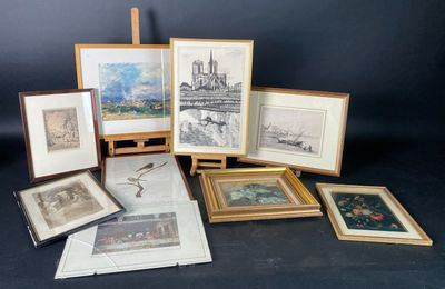 many framed pictures of different types of art on display