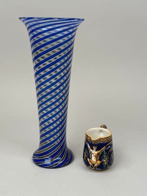 two vases that are sitting next to each other on a table