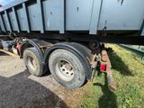 an image of a flatbed trailer parked on the side of the road