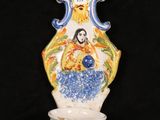 a vase that has a picture of a woman on it