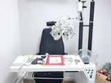 a desk with a computer and a pair of glasses on it