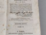an open book with a black and white title on it