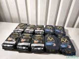 many bags of coffee sitting on a white table