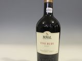a bottle of wine that is sitting on a table