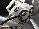 someone is using a circular saw to cut a piece of metal