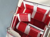 underside view of a red and white striped luggage case