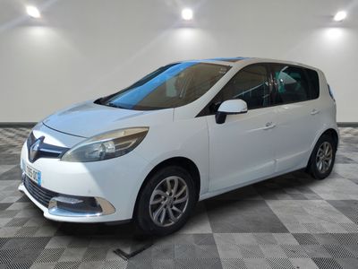 a picture of a white car parked in a garage