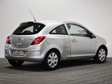 a picture of a silver car parked in a room