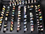 a lot of pins in a black case on a table