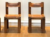 three wooden chairs sitting next to each other on a hard wood floor
