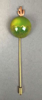 green and gold lapel pin with a cactus on top