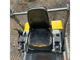 an image of a tractor with a seat on the back of it