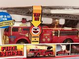 a toy fire engine in the box on the table
