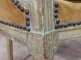 a close up of a chair with beads on it