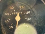 a close up of a speedometer in a glass container