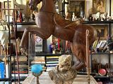 a statue of a horse and a dog on a table