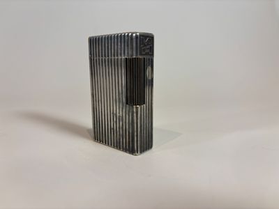 a lighter that is sitting on a white surface