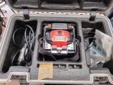 an open case with a tool in it on a table