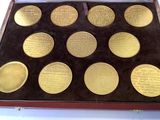 an image of a box of gold coins on a white surface