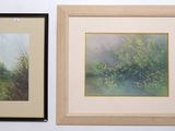 two framed paintings of trees on a wall next to each other
