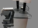 a computer desk with speakers and a keyboard on top of it