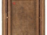 an old picture of a wooden frame with a tag on it