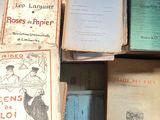 several old books are stacked on top of each other on a table