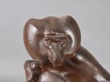 statue of a man with a monkey on his head