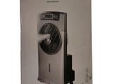 a box with a fan inside of it on a white surface