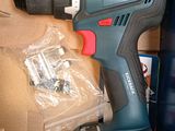 a cordless drill that is sitting in a box