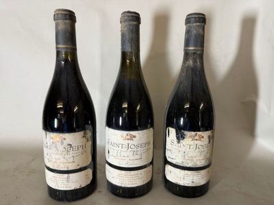 three bottles of wine are lined up on a counter top