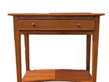 a small wooden table with a shelf underneath it