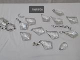 many pieces of plastic on a table with a white table cloth