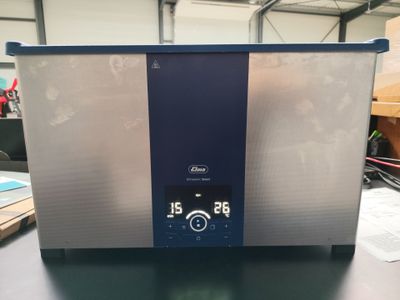 an image of a silver and blue chest freezer sitting on a table
